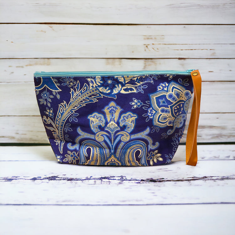 Sky blue mandala on navy clutch