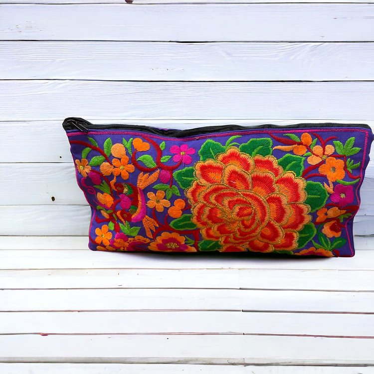 Tangerine blossom on purple clutch