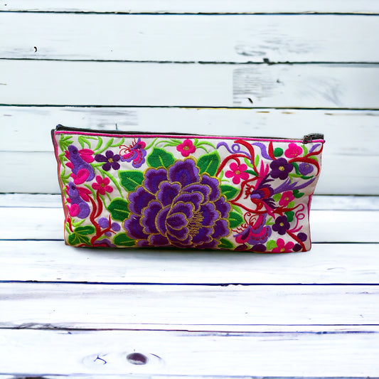 Violet blossom on white clutch