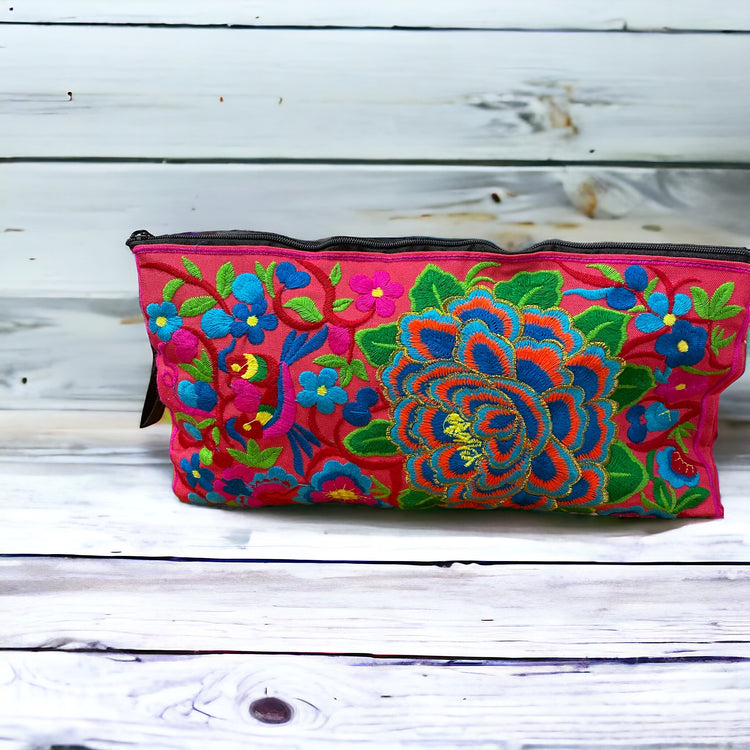 Aqua and tangerine blossom on pink clutch