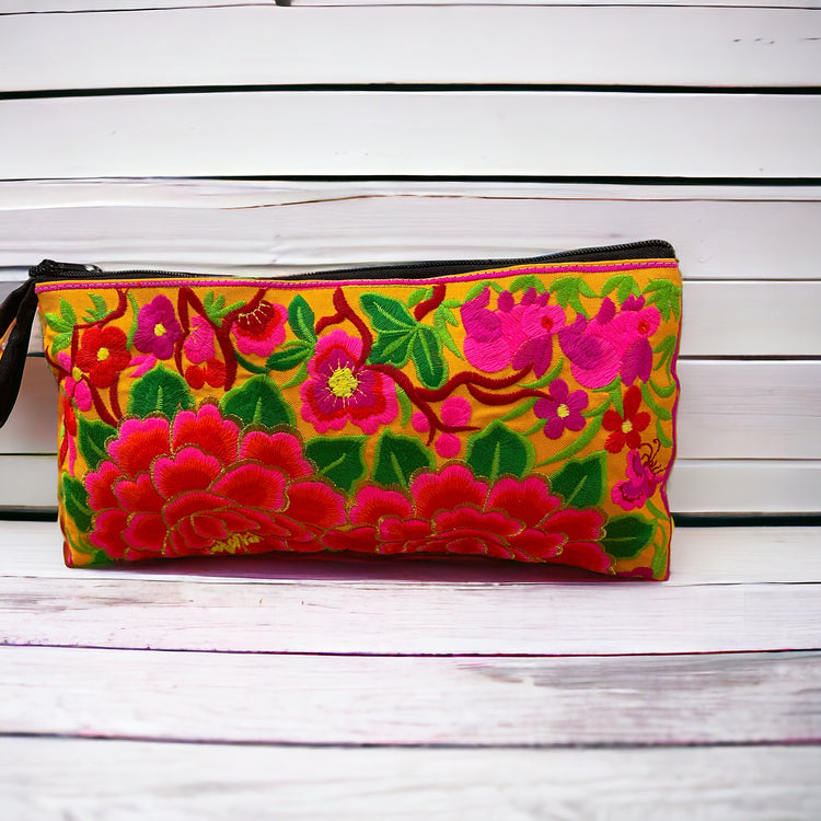 Hot pink and red blossom on sunshine yellow clutch