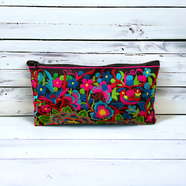 Aqua and tangerine blossom on licorice clutch