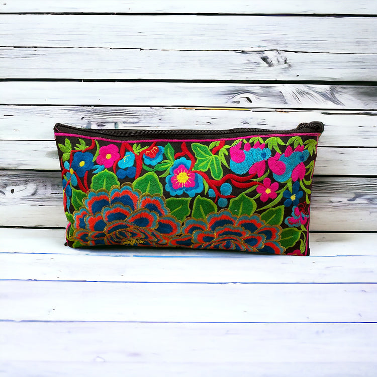 Aqua and tangerine blossom on licorice clutch