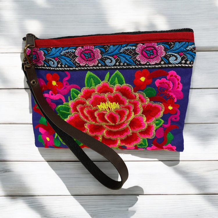 Ruby rose baby blossom on dark blue wristlet