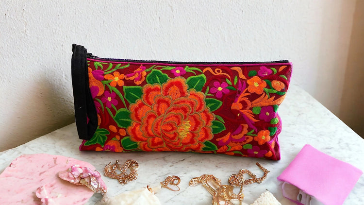 Tangerine blossom on ruby red clutch