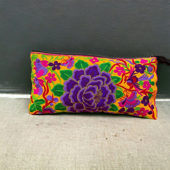 Violet blossom on sunshine yellow clutch