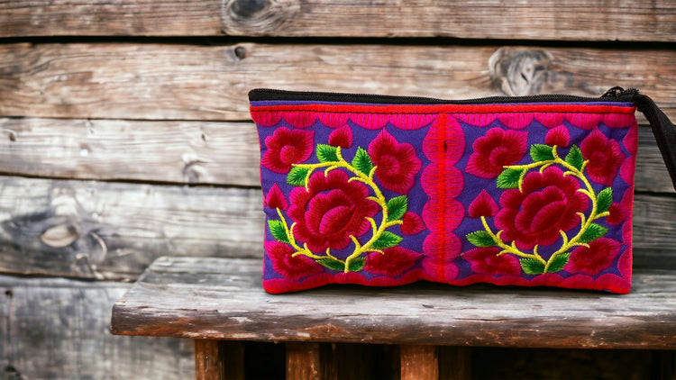 Cherry red baby blossom on purple wristlet