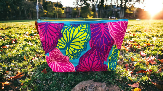 Neon yellow tropics on aqua clutch