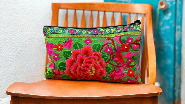 Scarlet and pink bloom on spring green clutch