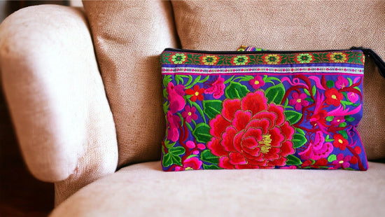 Scarlet and pink bloom on lavender clutch