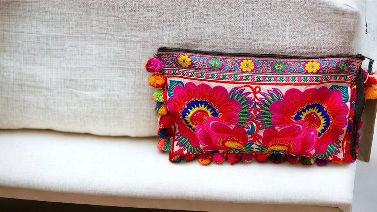 Hot pink & red poppy on white with multi-coloured pom pom clutch