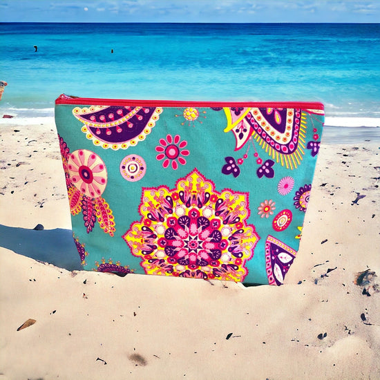 Musk pink and banana yellow mandala swirl on aqua clutch