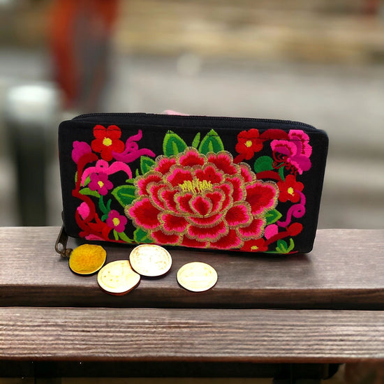 Hot pink and ruby red bloom on licorice purse