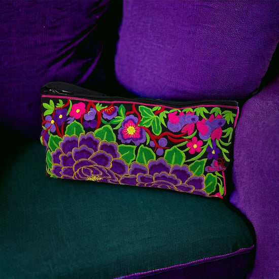 Violet florals on licorice clutch