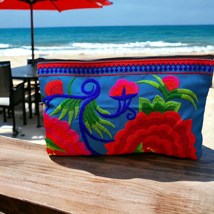 Ruby red bloom on marine blue clutch