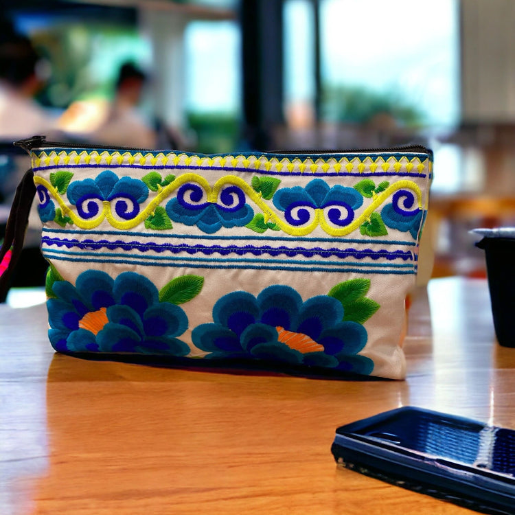 Aquamarine and cobalt blue poppy on white clutch