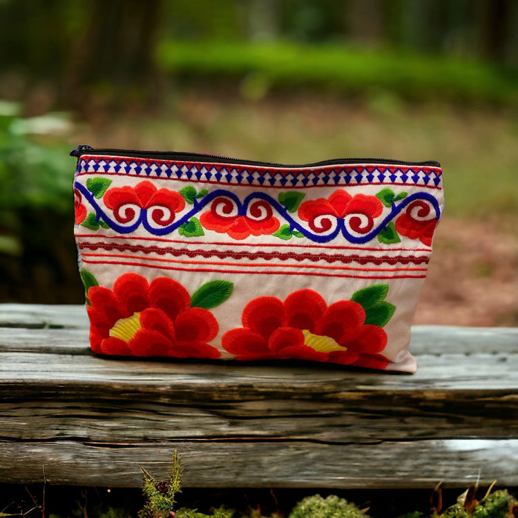 Ruby red poppy on white clutch