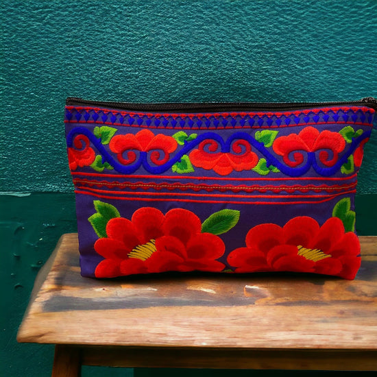 Ruby red poppy on electric blue clutch