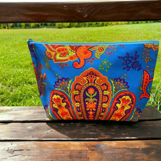 Tangerine and lemon paisley on aquamarine clutch