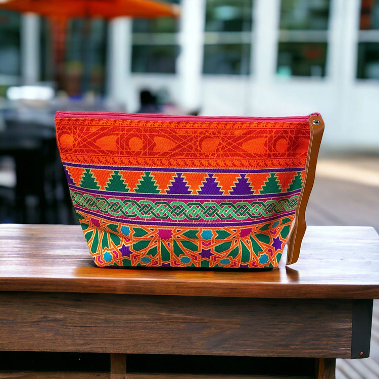 Forest green mandala on tangerine clutch